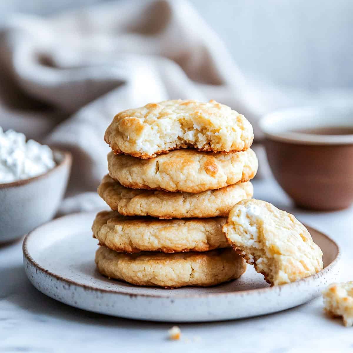 Stack of gluen-free cottage cheese cookies on a small serving plate.