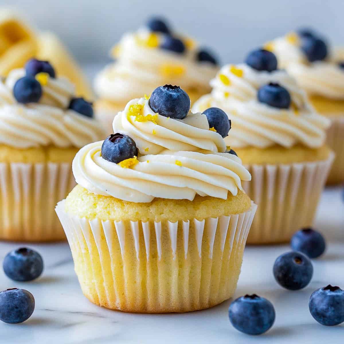 Side view of lemon blueberry cupcakes.