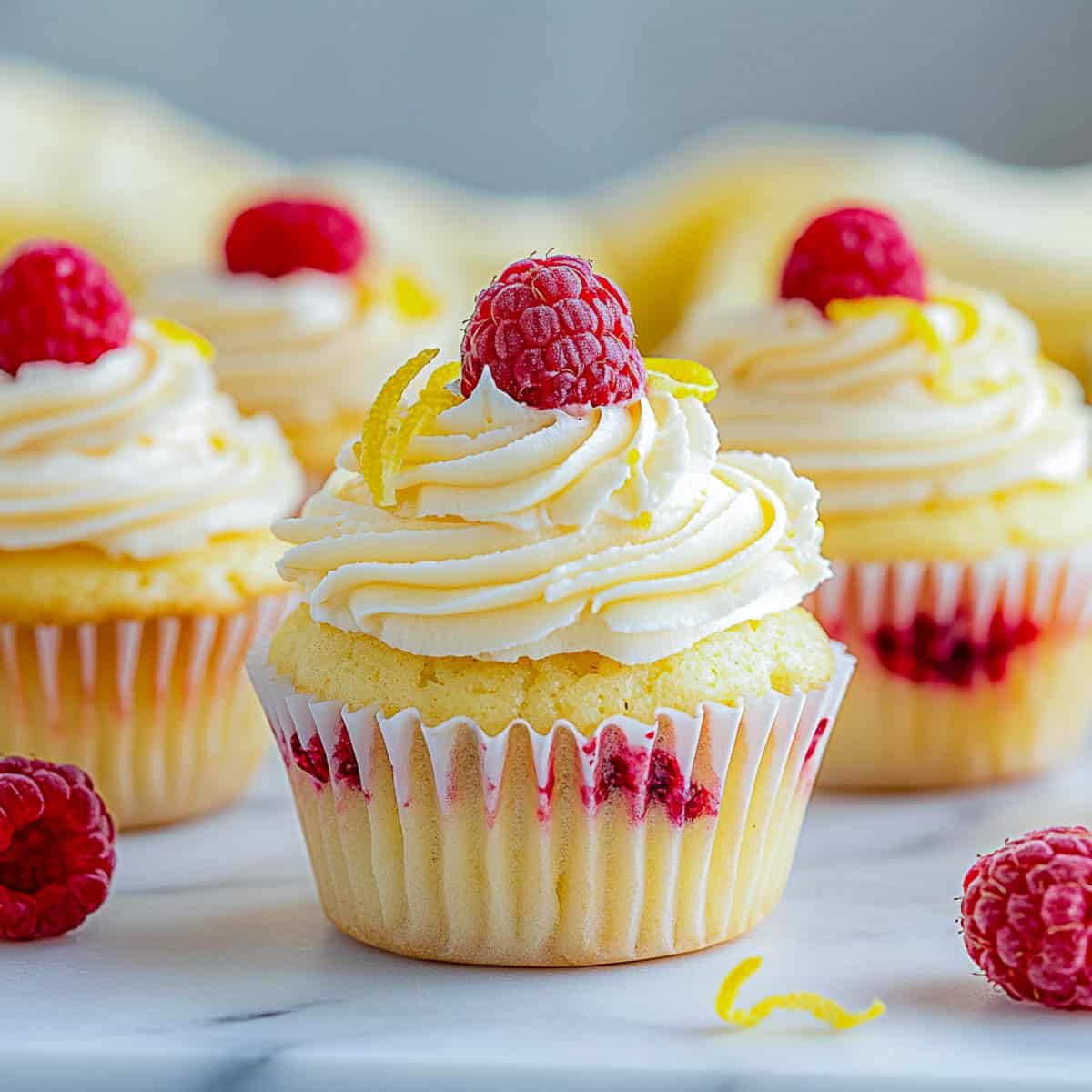 Side view of lemon raspberry cupcakes.