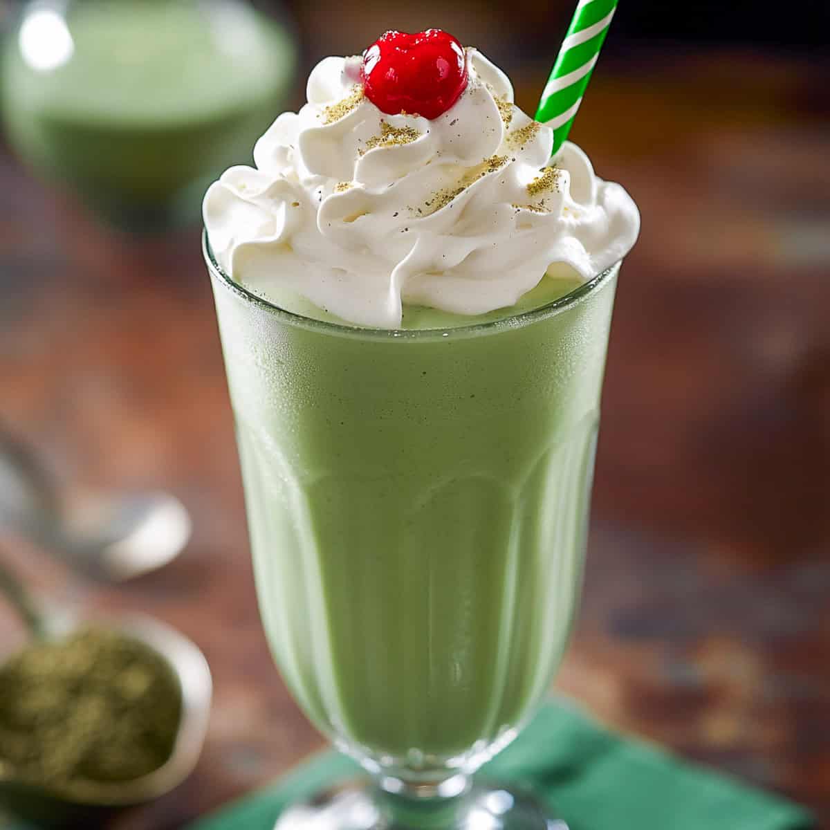 Shamrock milkshake in a tall glass.