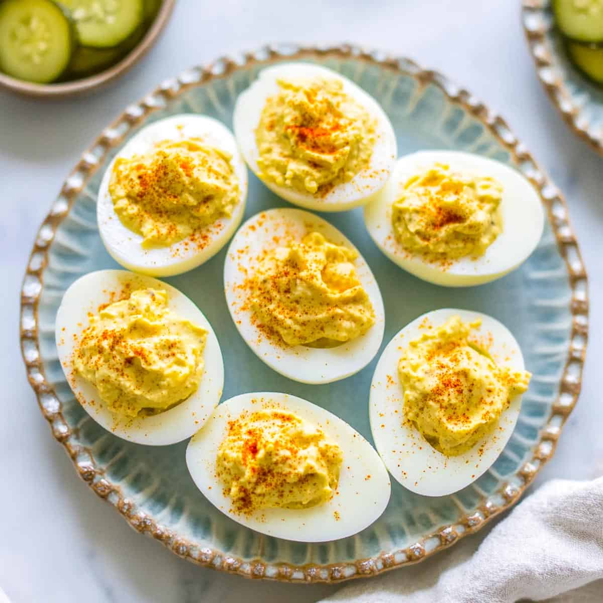 Southern deviled eggs placed on a blue serving plate.