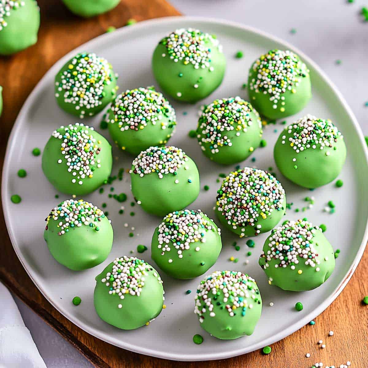 St Patrick's Day oreo balls served on a white plate.