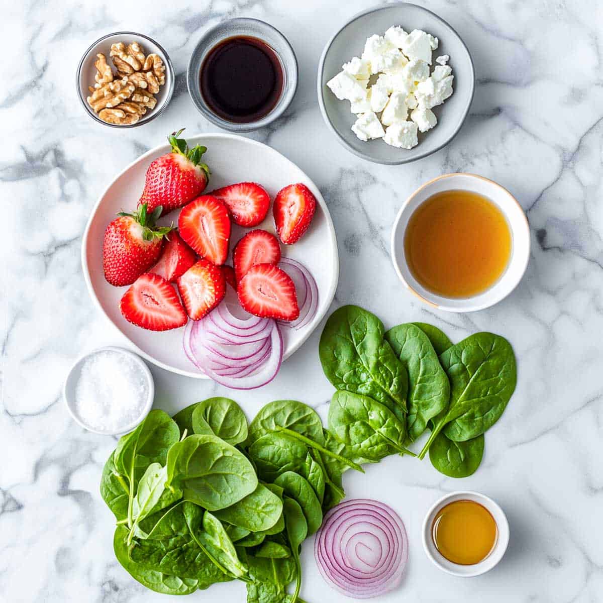 Ingredients placed on a white marble surface.