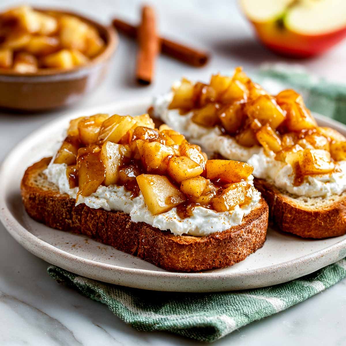 Thick toast with cottage cheese and warm apple pie topping.