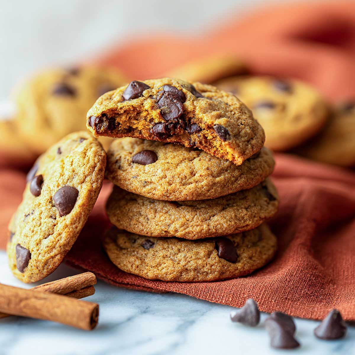 Thick, chewy pumpkin cookies with chocolate chips and warm fall spices.