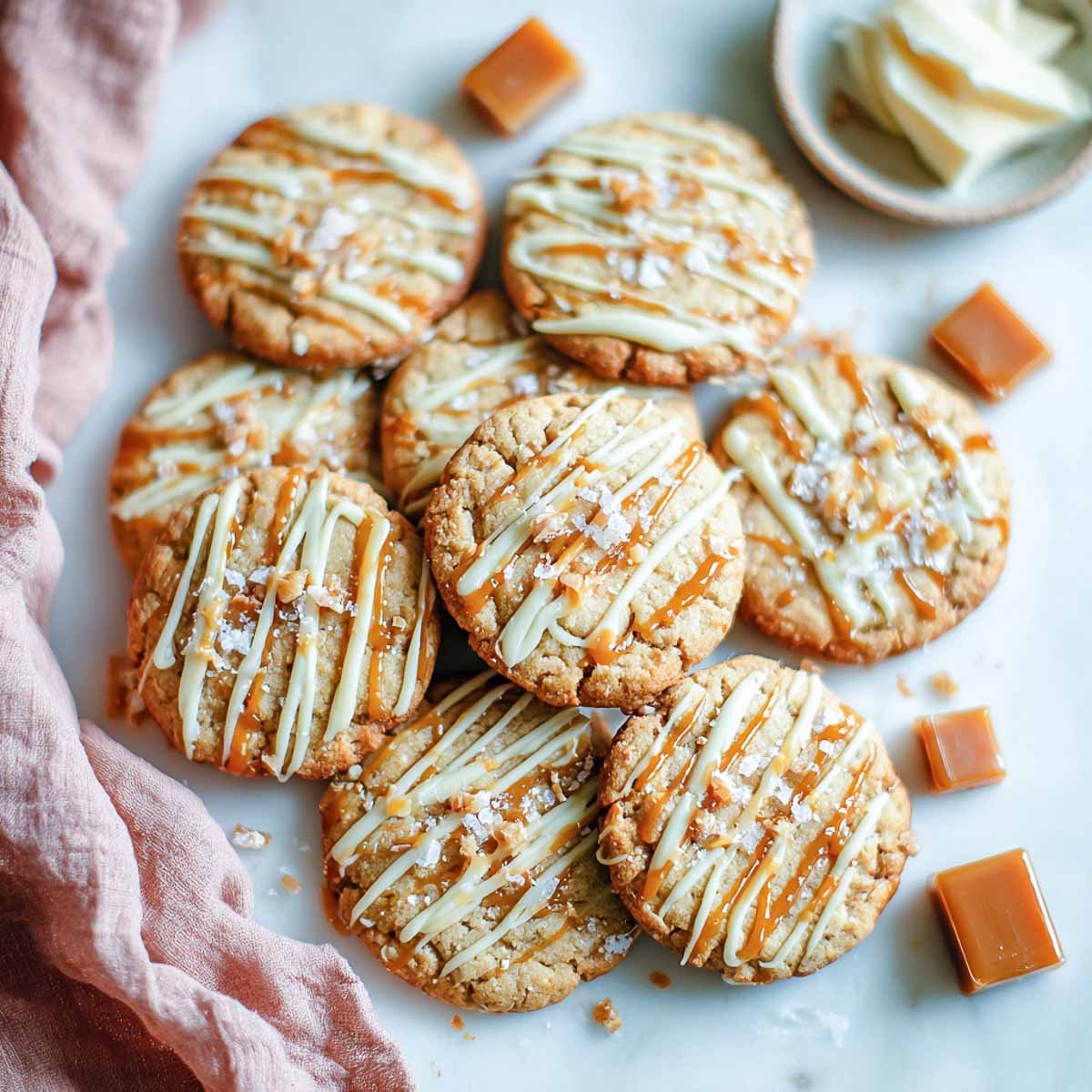 Salted caramel toffee cookies with buttercream drizzle and a light sea salt sprinkle.