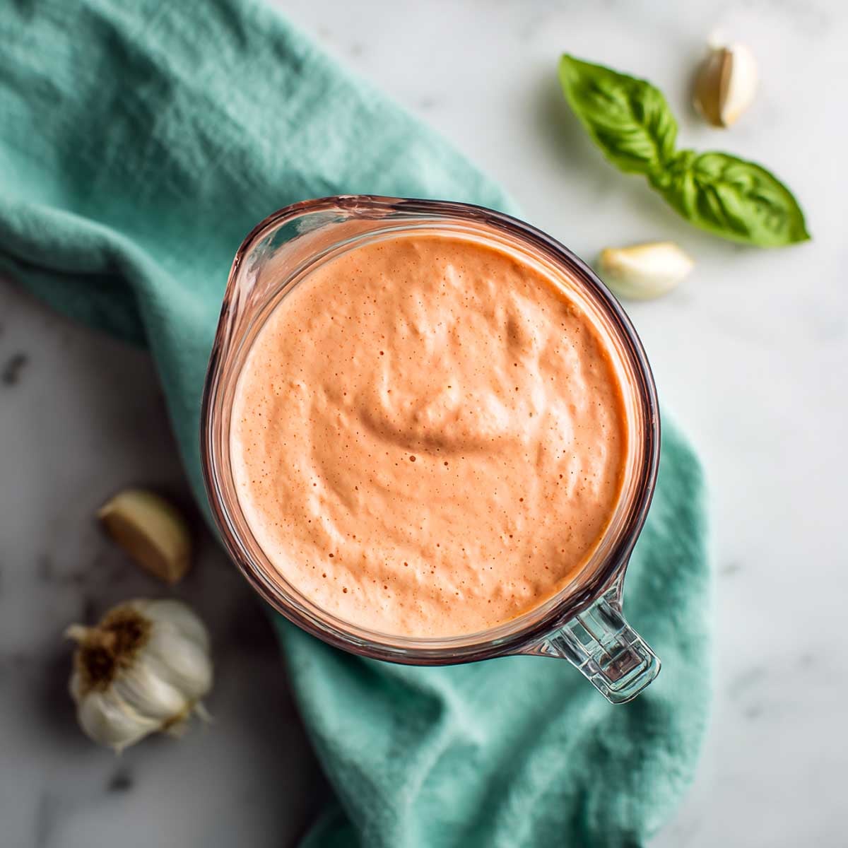 Blended creamy tomato cottage cheese sauce in a glass blender jar.