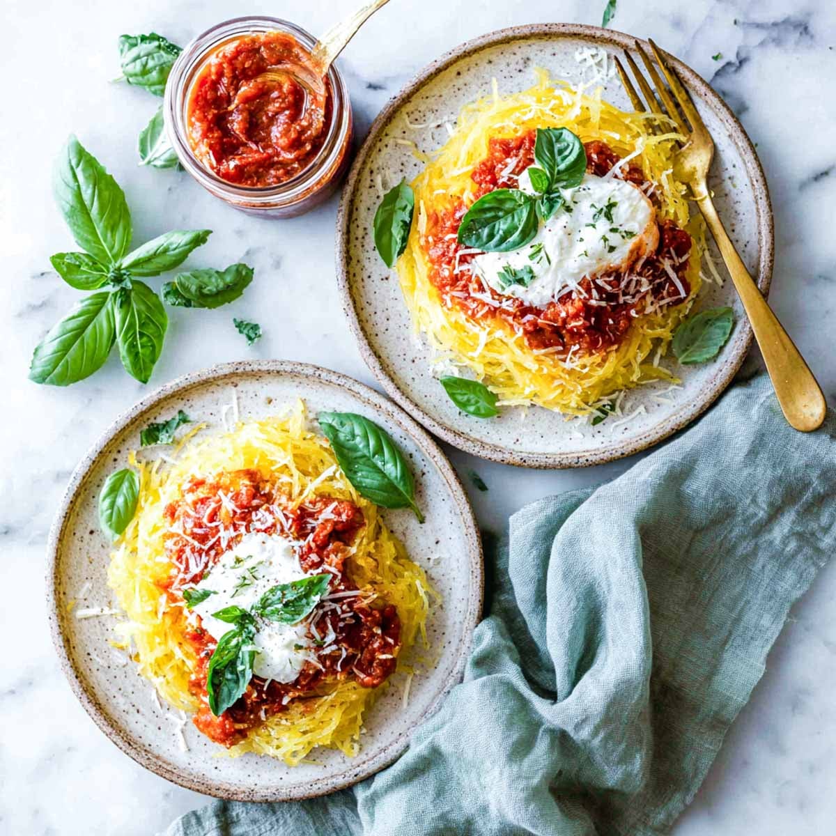 Spaghetti squash with creamy marinara cottage cheese sauce and fresh basil.