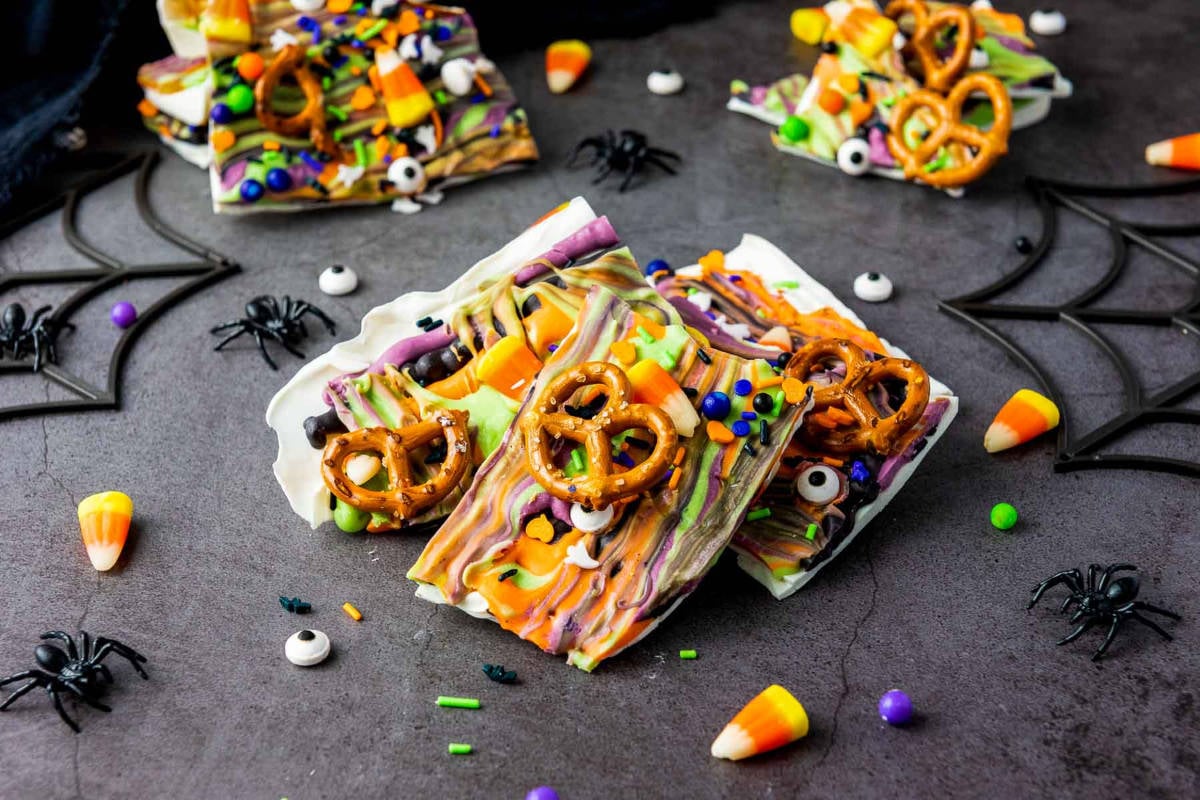 Halloween candy bark on a gray surface.