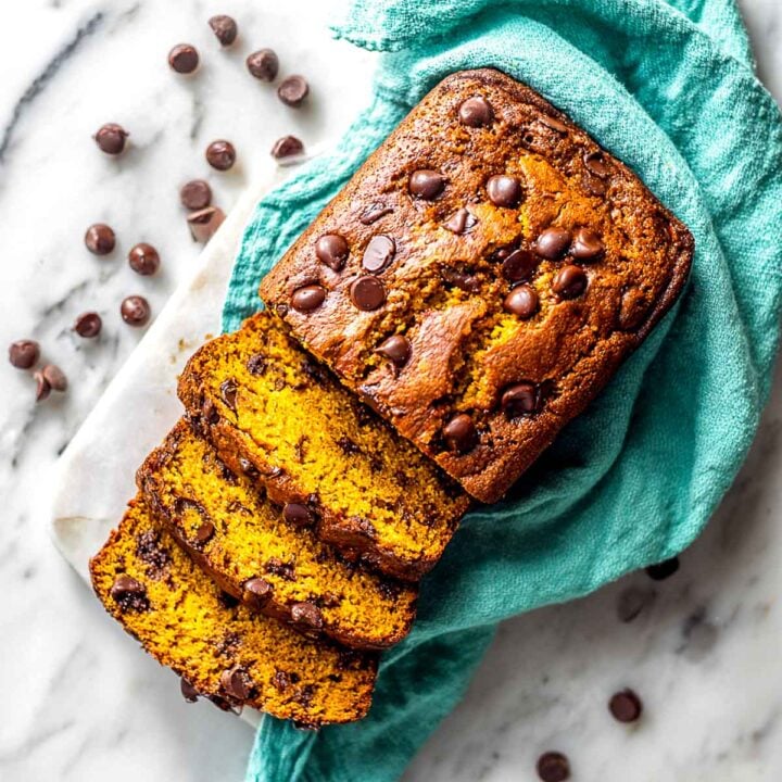 Top-down view of sliced air fryer chocolate chip pumpkin bread loaf.