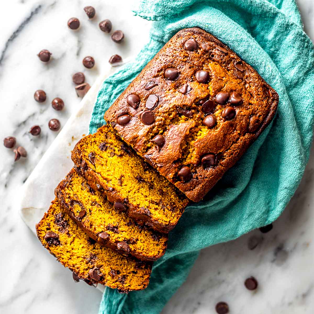 Top-down view of sliced air fryer chocolate chip pumpkin bread loaf.