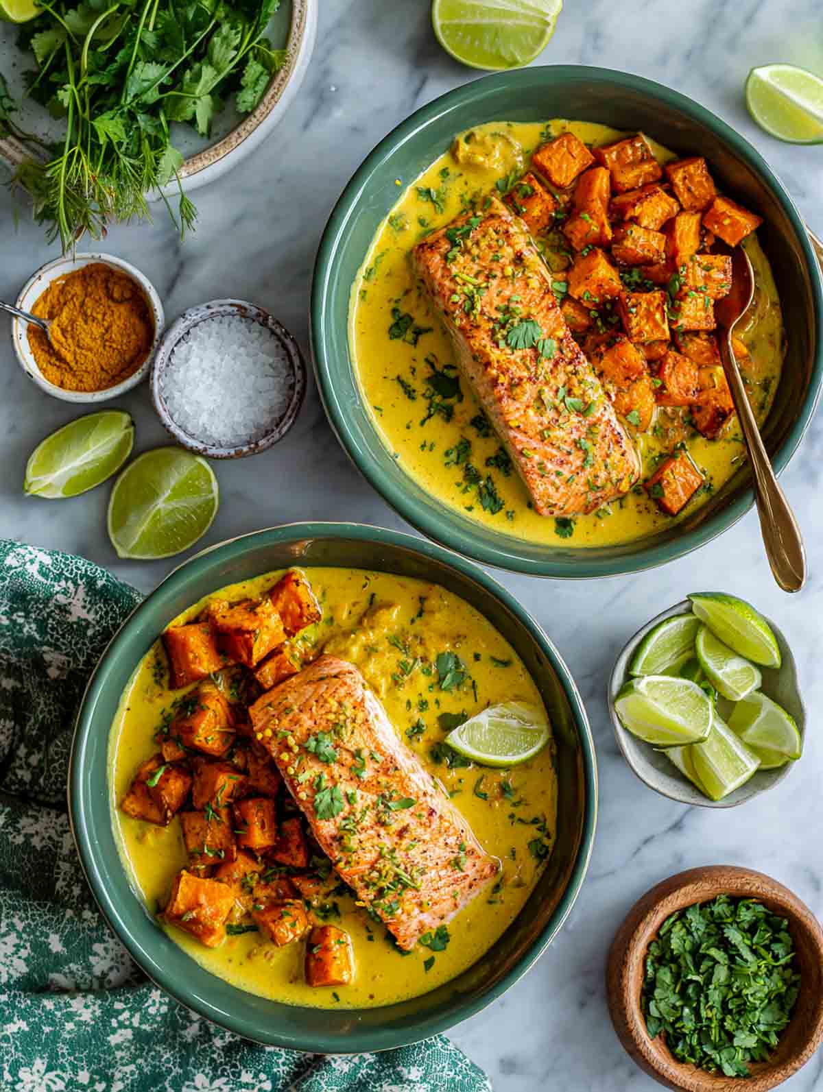 Creamy coconut-curry salmon with roasted sweet potato chunks in cozy sage bowls.