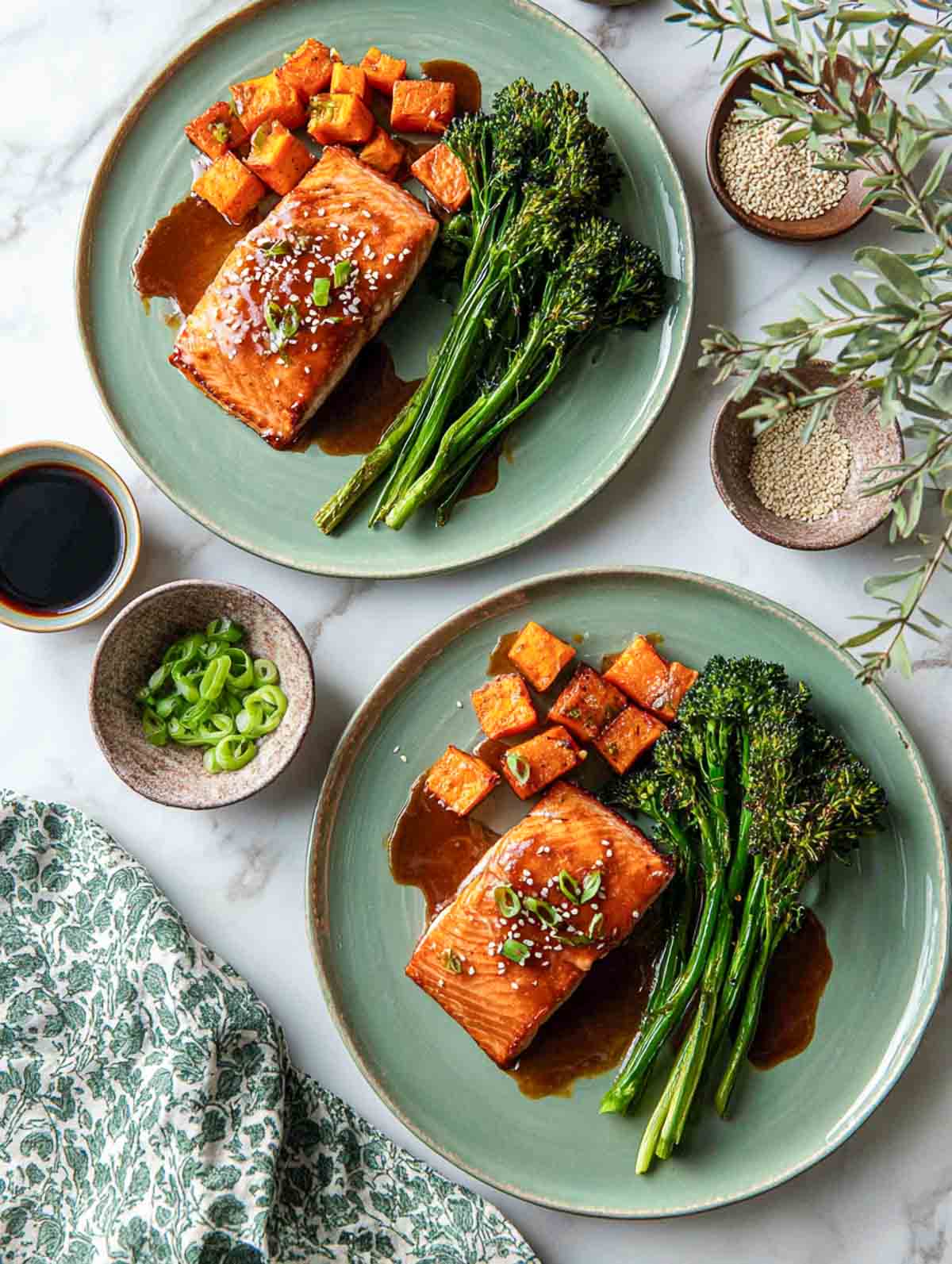 Ginger-soy salmon with roasted sweet potatoes and broccolini on sage plates.