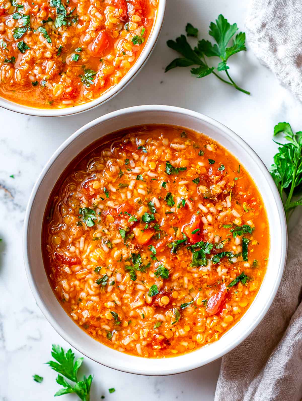Tomato lentil rice cooker soup with herbs, thick and hearty.