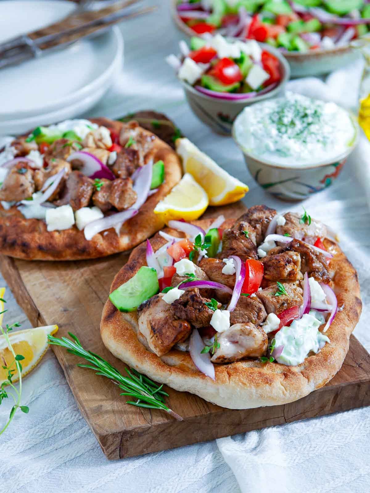 Souvlaki pita with grilled meat, vegetables, and tzatziki