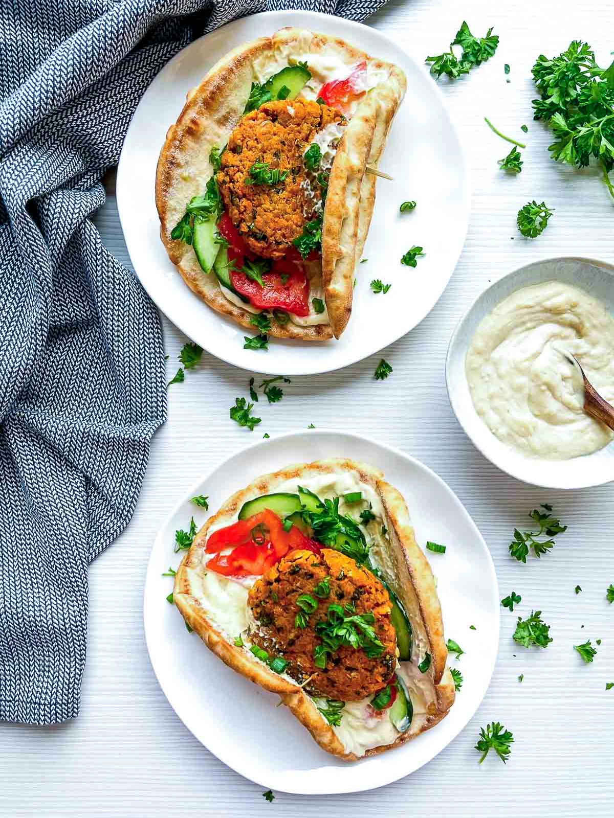 Falafel pita with cucumber, tomato, and creamy sauce.