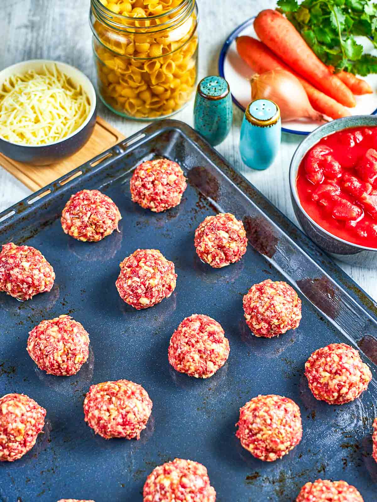 Raw meatballs on baking tray