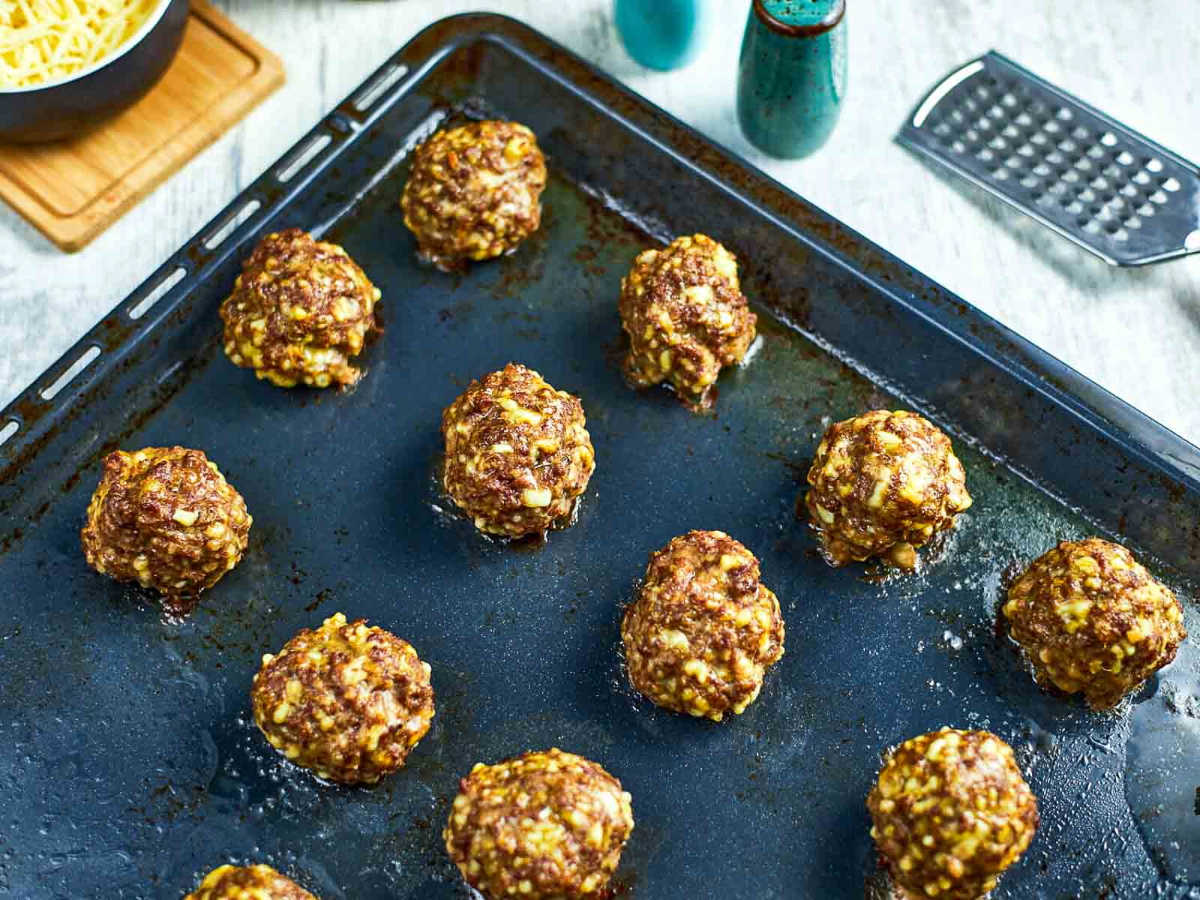Baked meatballs on sheet pan.